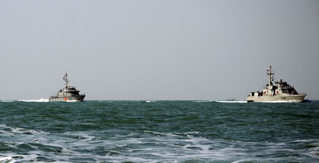 US ship fires shot at Iranian boat